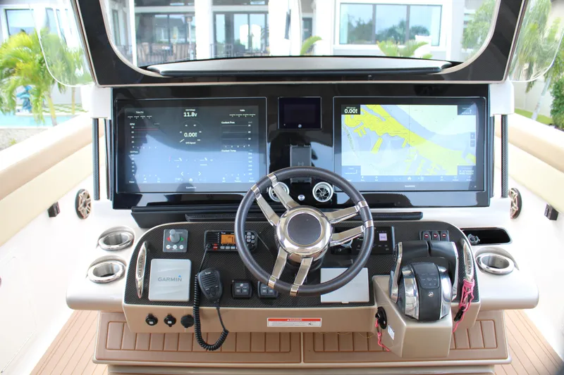 Slide: The Image of 2021 Mystic Powerboats M4200 helm with advanced navigation and control systems. - 49