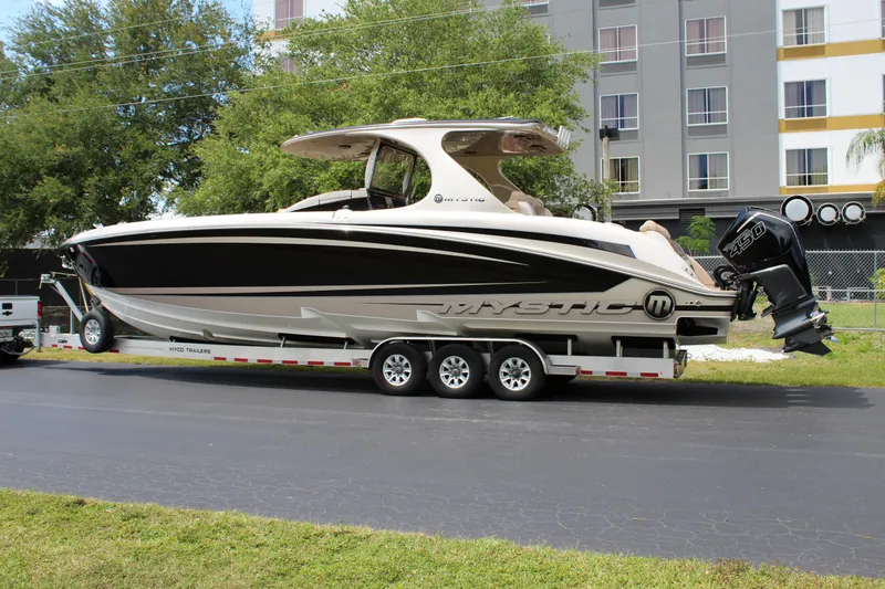 Slide: The Image of 2021 Mystic Powerboats M4200 on trailer, side view. - 5