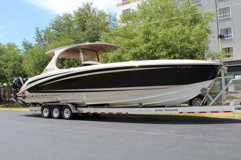 Slide: The Image of 2021 Mystic Powerboats M4200 on trailer, side view. - 6