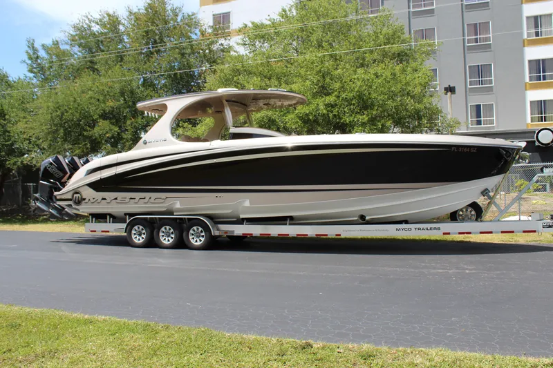 Slide: The Image of 2021 Mystic Powerboats M4200 on a trailer, parked outdoors. - 7