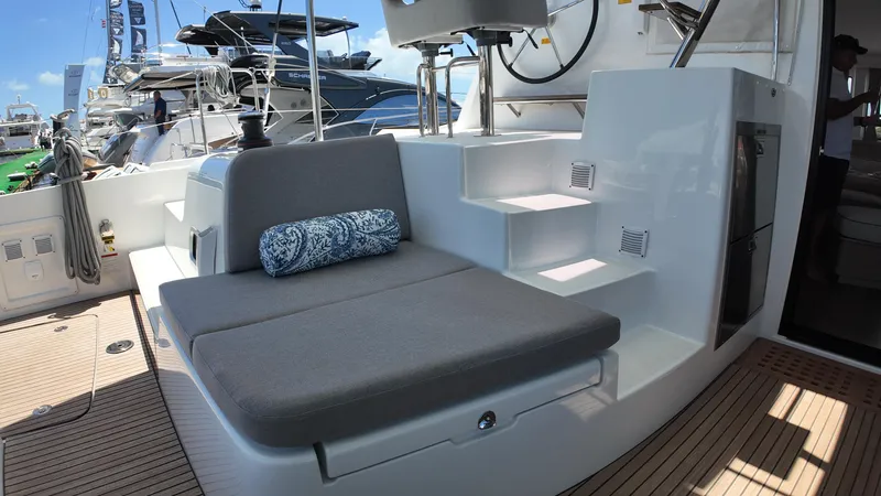 Slide: The Image of 2025 Lagoon 42 yacht interior with cushioned seating and modern design. - 42