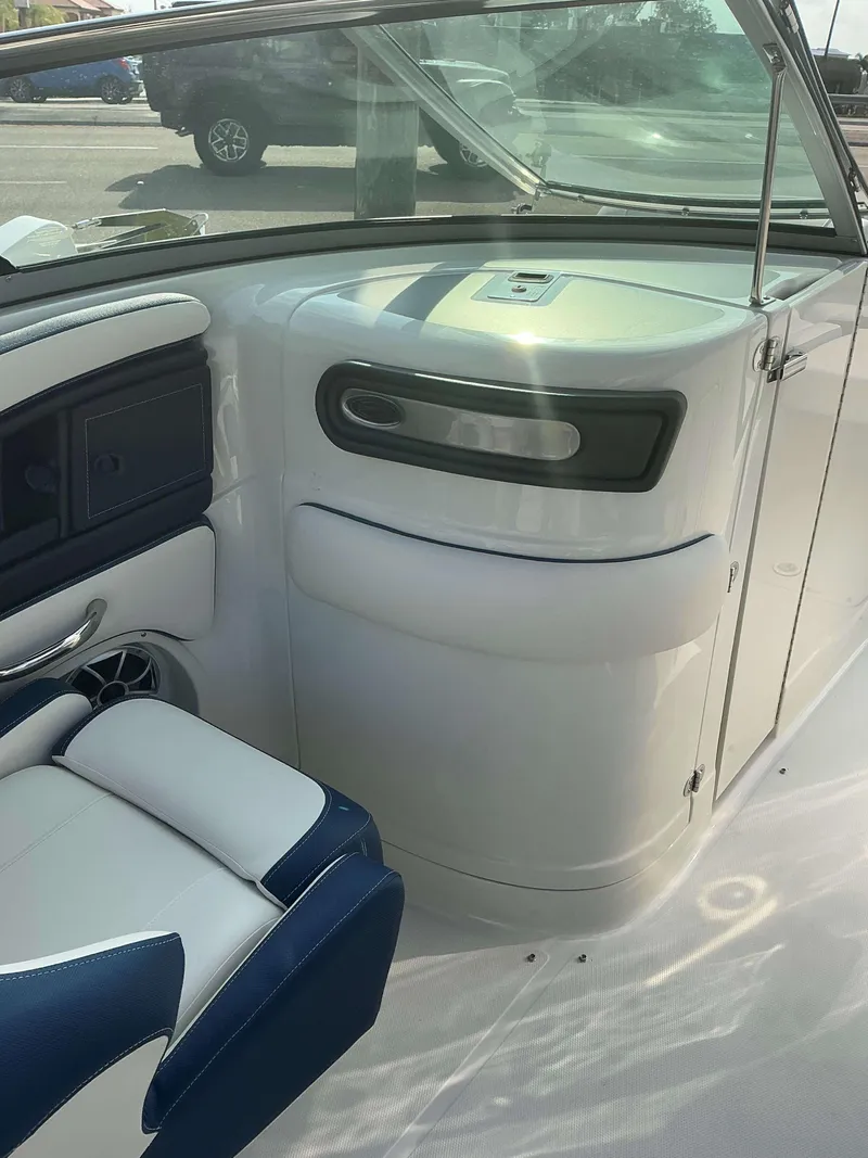 Slide: The Image of 2024 Crownline 290 XS boat interior with sleek seating and modern design. - 12
