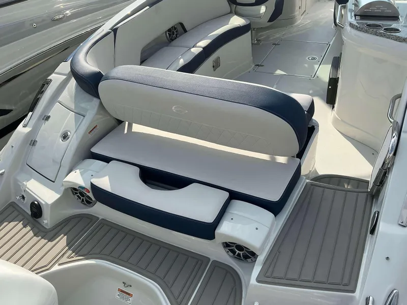 Slide: The Image of 2024 Crownline 290 XS boat interior with cushioned seating and modern design. - 6