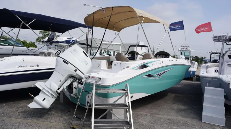 Slide: The Image of 2024 Hurricane 218 SS boat with Suzuki outboard motor on display. - 11