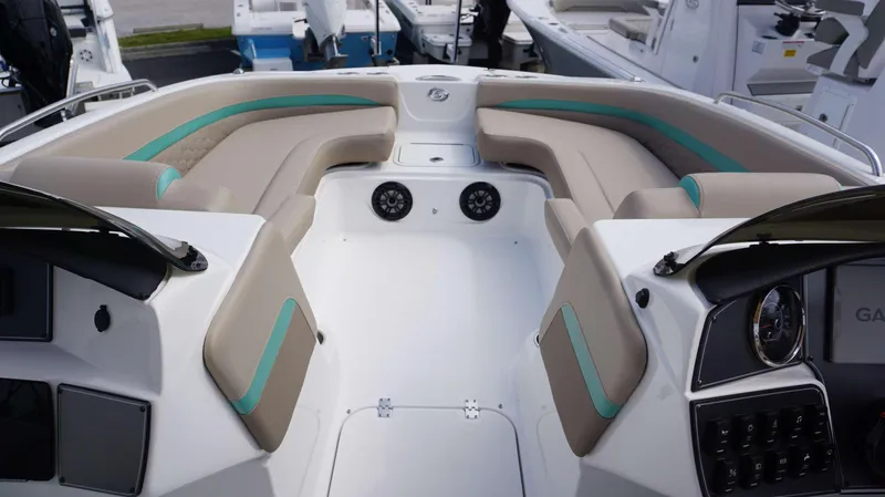 Slide: The Image of 2024 Hurricane 218 SS boat interior with beige and teal seating. - 14