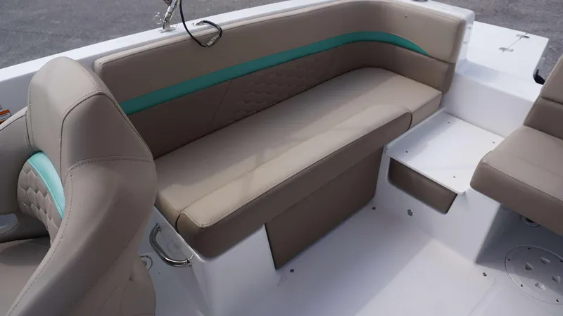 Slide: The Image of Interior seating of 2024 Hurricane 218 SS boat with beige and teal upholstery. - 5
