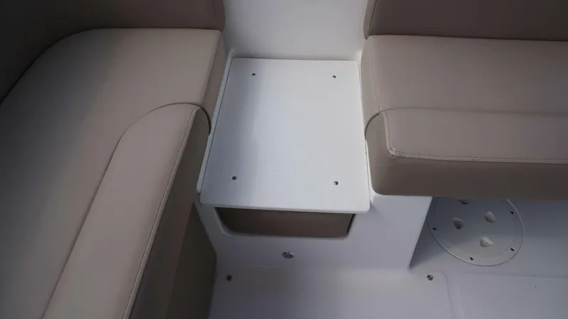 Slide: The Image of Interior seating of 2024 Hurricane 218 SS boat with beige cushions and white flooring. - 6