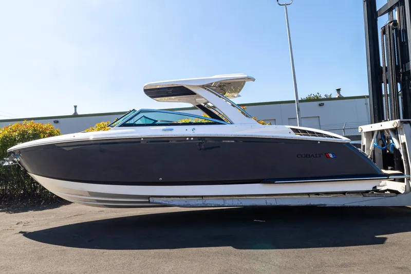 The Image of 2024 Cobalt R33 boat on a trailer outdoors. - 1