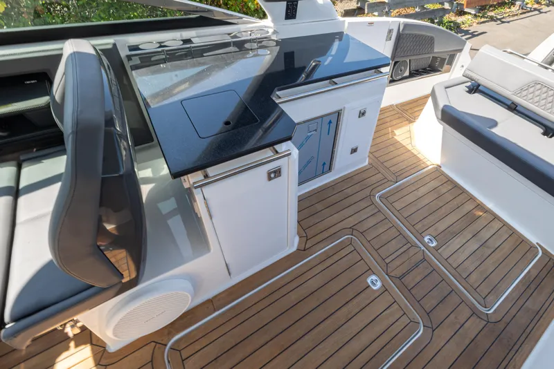 Slide: The Image of 2024 Cobalt R33 boat interior with sleek seating and modern amenities. - 10