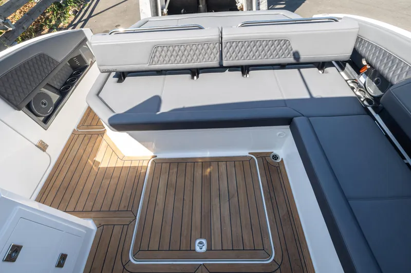 Slide: The Image of Luxurious interior of 2024 Cobalt R33 boat with elegant seating and wood flooring. - 13