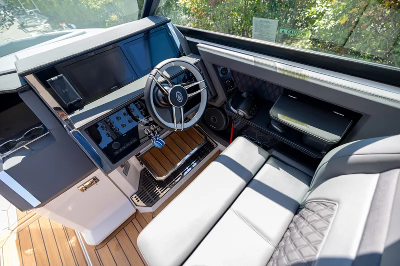 Slide: The Image of 2024 Cobalt R33 boat cockpit with modern steering and control panel. - 15