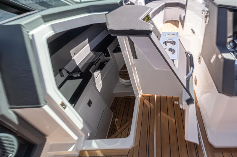 Slide: The Image of Interior of 2024 Cobalt R33 boat with sleek design and wood flooring. - 16