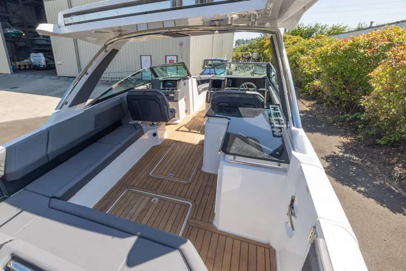Slide: The Image of 2024 Cobalt R33 boat interior with sleek design and wooden flooring. - 4