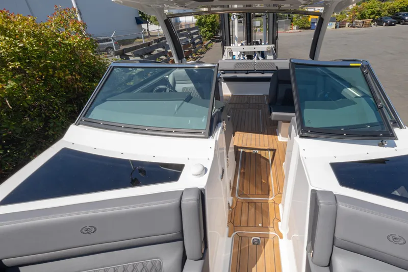 Slide: The Image of 2024 Cobalt R33 boat with sleek design and spacious interior, featuring luxurious seating. - 7