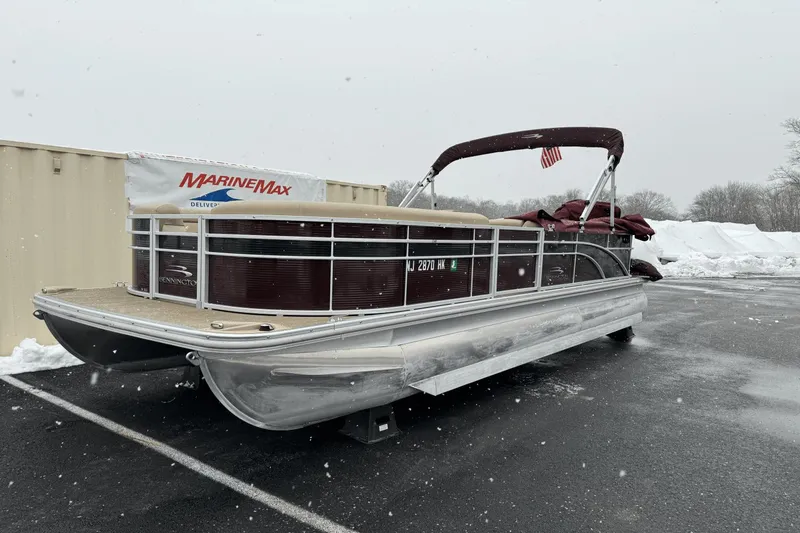 Slide: The Image of 2017 Bennington SX24 pontoon boat in a snowy parking lot. - 1
