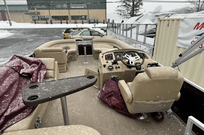 Slide: The Image of 2017 Bennington SX24 pontoon boat interior covered in snow. - 26