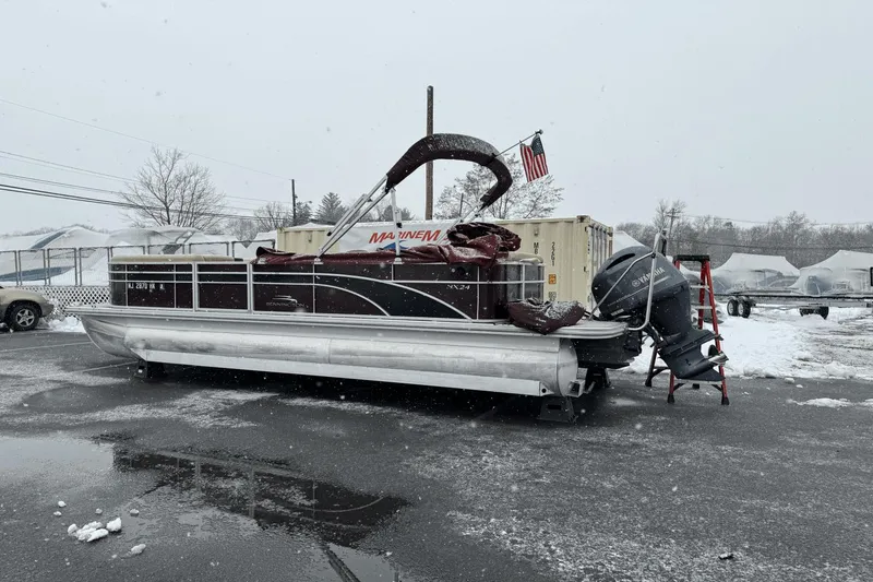 Slide: The Image of 2017 Bennington SX24 pontoon boat in snowy parking lot. - 31