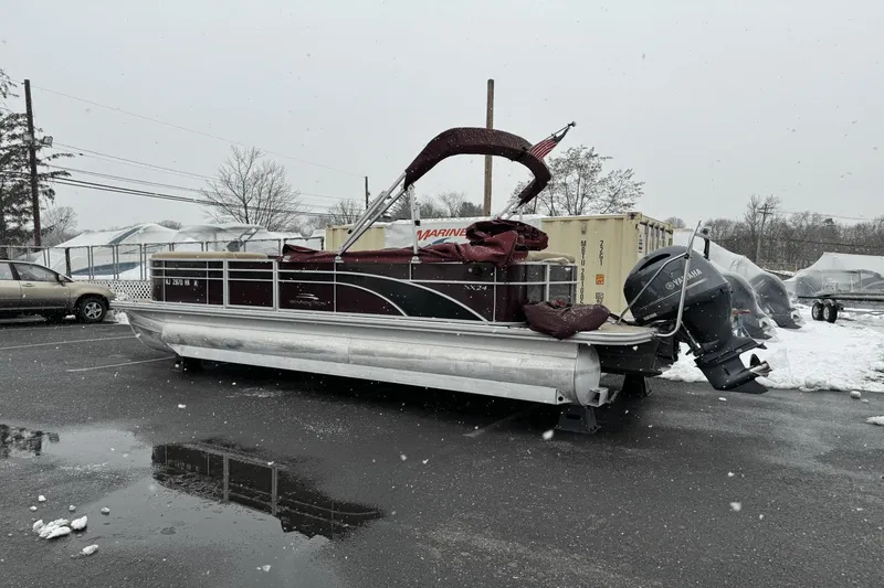 Slide: The Image of 2017 Bennington SX24 pontoon boat in a snowy parking lot. - 6
