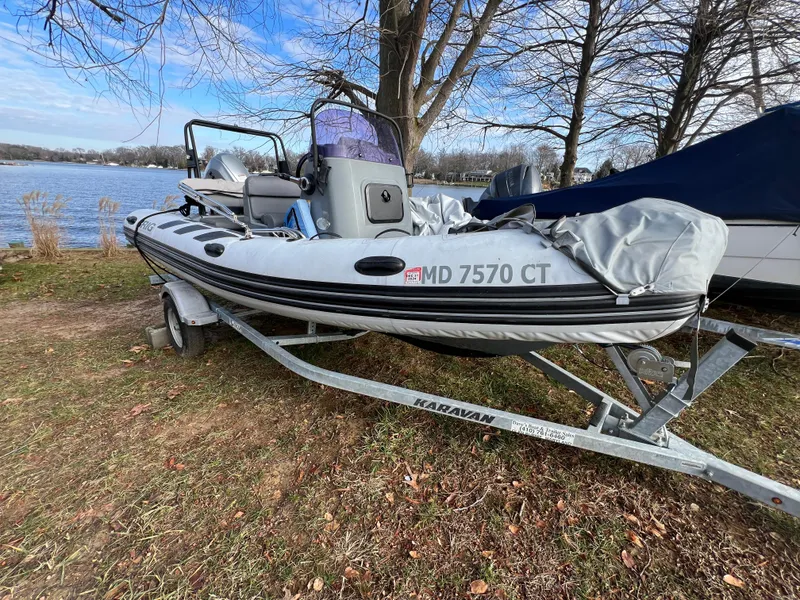 Slide: The Image of 2021 Brig Inflatables Navigator 520 on Karavan trailer by lakeside. - 24