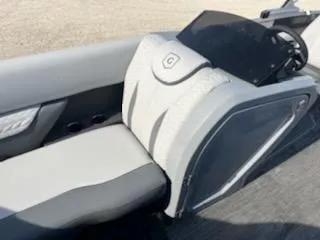 Slide: The Image of 2021 Godfrey Monaco 255SFL boat interior with sleek, modern seating and dashboard. - 4