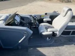 Slide: The Image of 2021 Godfrey Monaco 255SFL boat cockpit with captain's chair and control panel. - 5