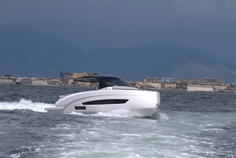 The Image of Nassima Yacht N40 2025 model cruising on the water with a coastal city backdrop. - 0