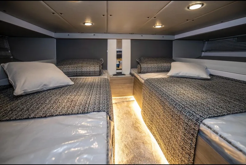 Slide: The Image of Luxurious cabin interior of Nassima Yacht N40, 2025 model, featuring twin beds and modern lighting. - 17