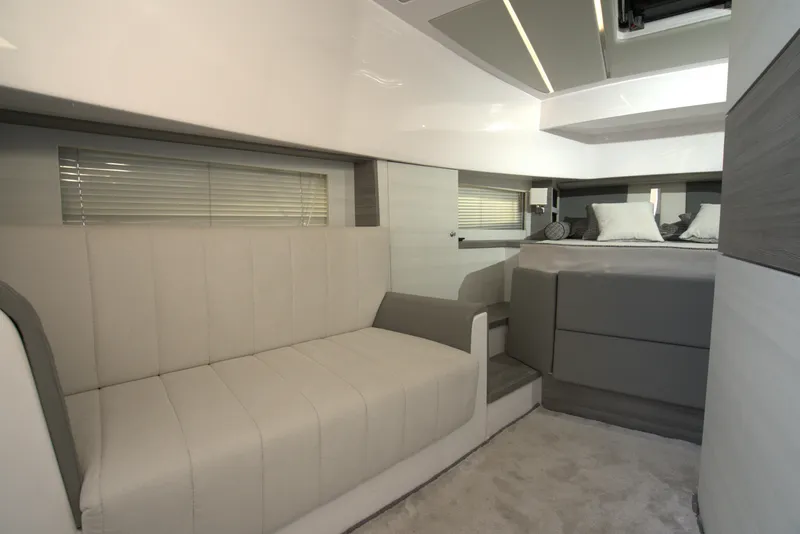 Slide: The Image of Luxurious interior of Nassima Yacht N40, 2025 model, featuring modern seating and a cozy bed. - 22