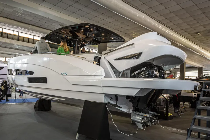 Slide: The Image of Nassima Yacht N40 2025 model displayed indoors with Mercury outboard engines. - 5