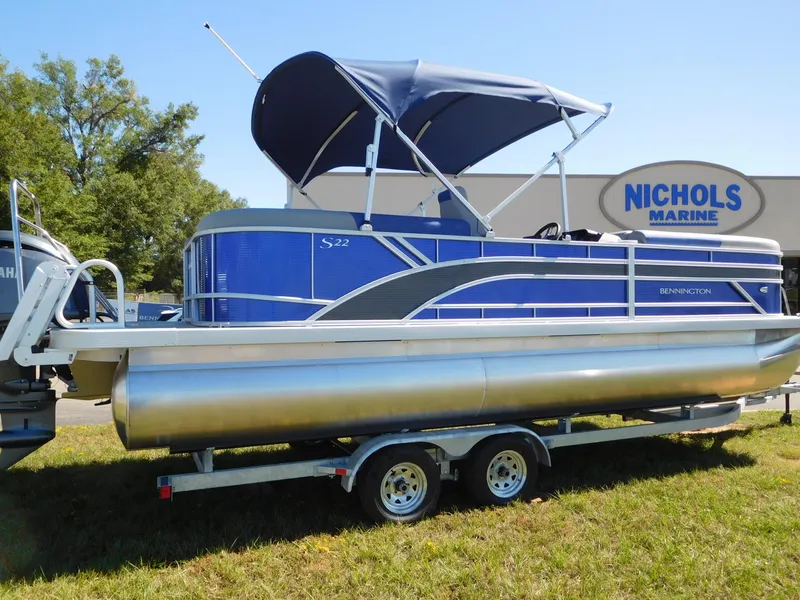 Slide: The Image of 2024 Bennington 22 SSR pontoon boat with blue canopy at Nichols Marine. - 0