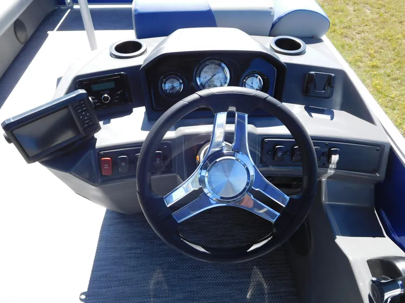 Slide: The Image of 2024 Bennington 22 SSR boat dashboard with steering wheel and gauges. - 3