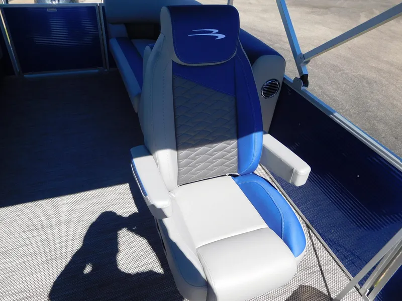 Slide: The Image of 2024 Bennington 22 SSR boat interior with blue and gray captain's chair. - 4