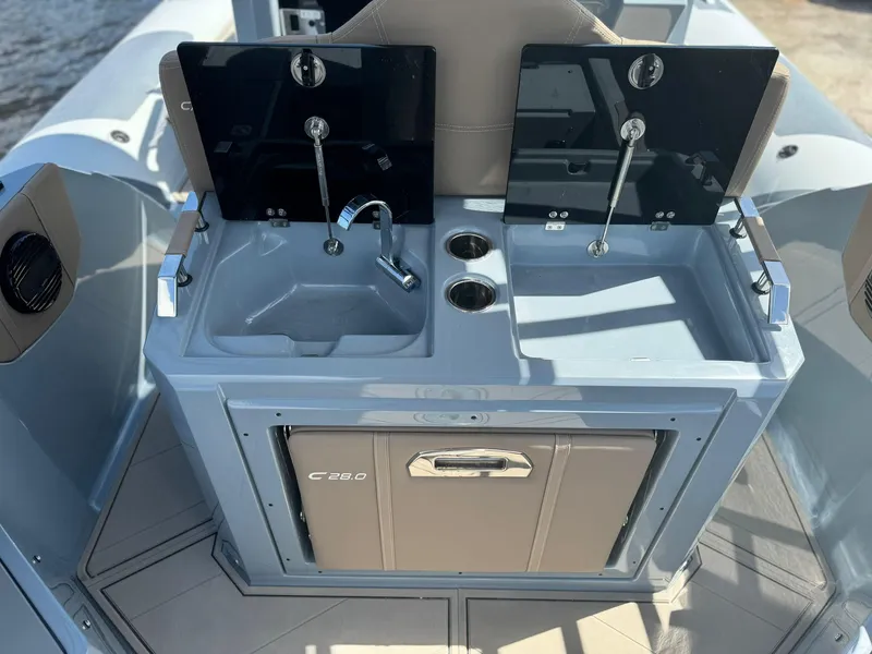 Slide: The Image of Dual sink setup on the 2025 Ranieri CAYMAN 28 EXECUTIVE boat. - 13