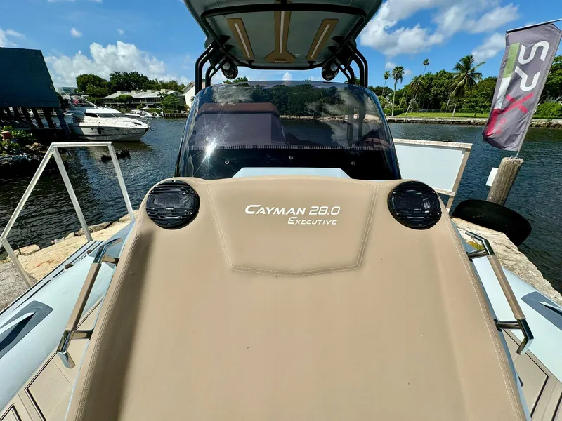 Slide: The Image of 2025 Ranieri CAYMAN 28 EXECUTIVE boat docked by a scenic waterfront. - 21