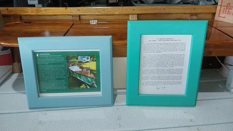 Slide: The Image of Framed information about a 2020 Custom 16 Skiff boat displayed on a wooden surface. - 10