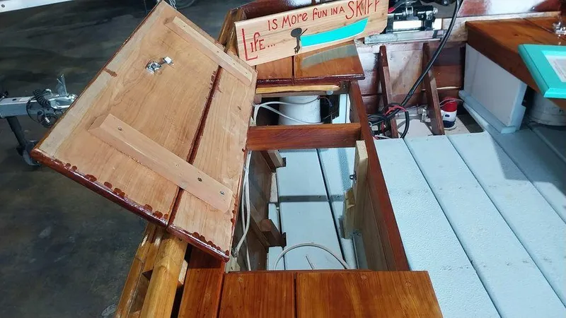 Slide: The Image of Open storage compartments on a 2020 Custom 16 Skiff boat. - 4