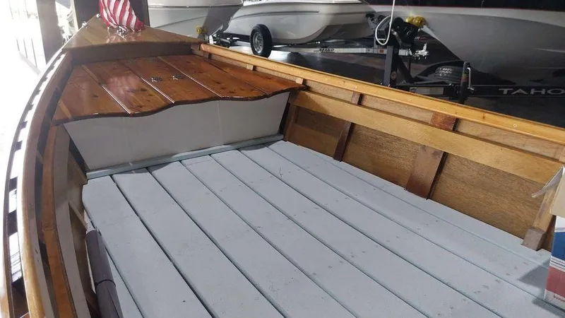 Slide: The Image of 2020 Custom 16 Skiff boat interior with wooden and white deck - 8