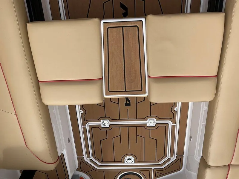 Slide: The Image of 2024 Moomba Tykon interior with beige seats and wood accents. - 13