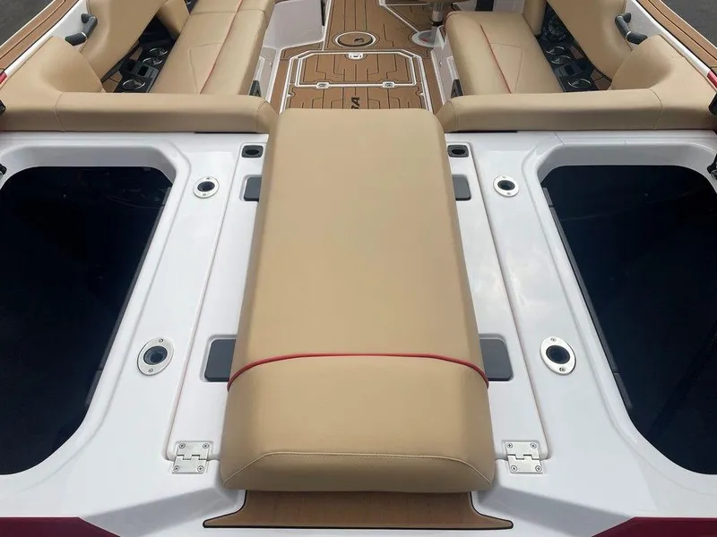 Slide: The Image of 2024 Moomba Tykon boat interior with beige seating and storage compartments. - 17