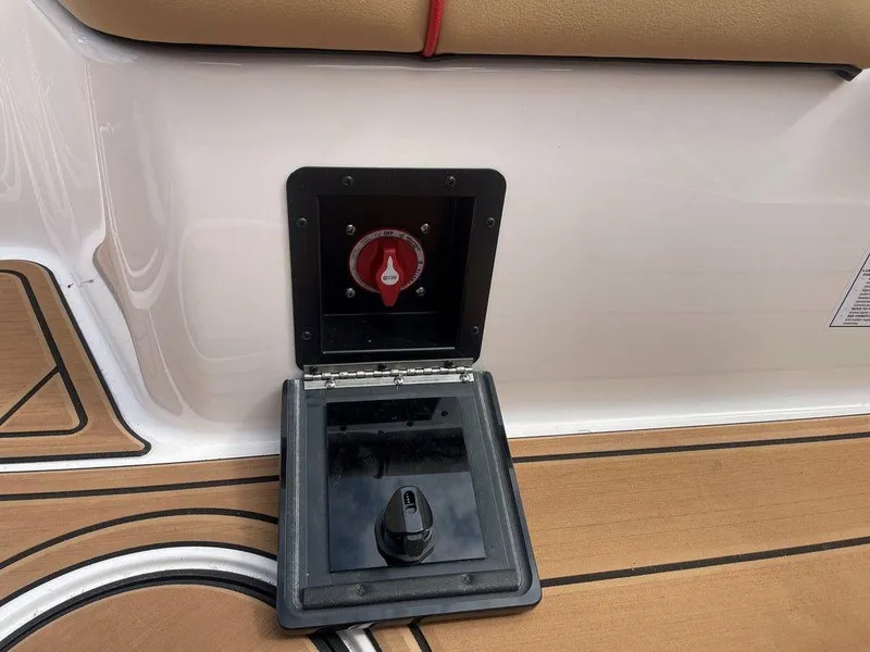 Slide: The Image of 2024 Moomba Tykon boat battery switch and control panel on deck. - 18