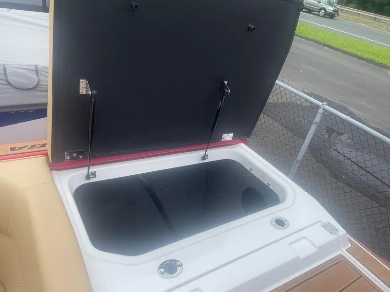 Slide: The Image of Open storage compartment in 2024 Moomba Tykon boat, showcasing spacious interior. - 2