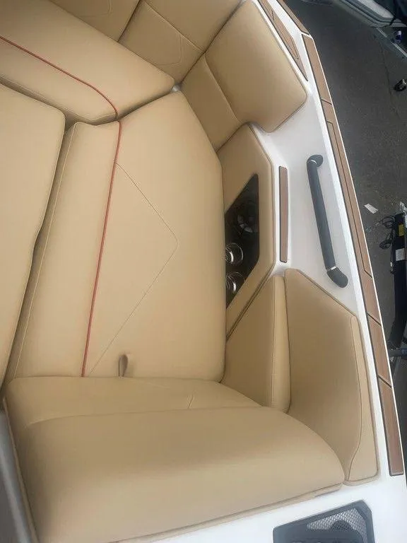 Slide: The Image of 2024 Moomba Tykon boat interior with tan leather seating and modern design. - 20