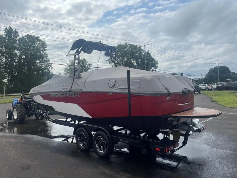 Slide: The Image of 2024 Moomba Tykon boat on trailer, covered, parked outdoors. - 21