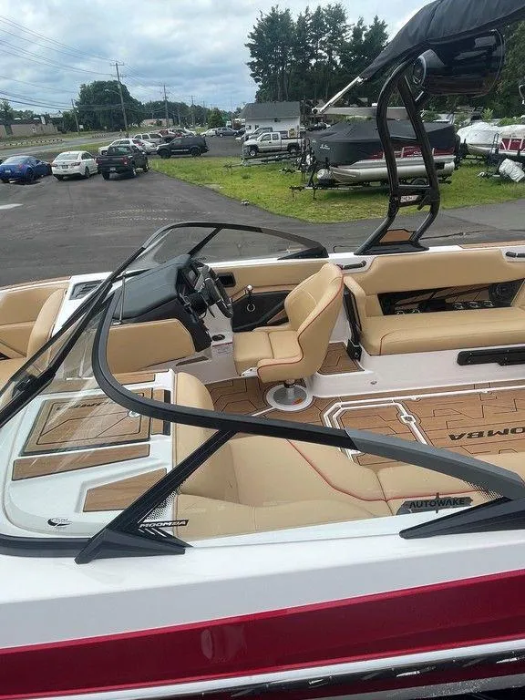 Slide: The Image of 2024 Moomba Tykon boat with tan interior and sleek design. - 24