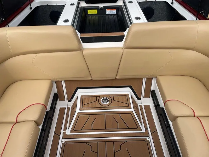 Slide: The Image of 2024 Moomba Tykon boat interior with beige seating and stylish flooring. - 29