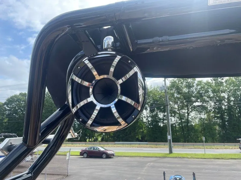 Slide: The Image of 2024 Moomba Tykon boat speaker with sleek chrome design against a clear sky background. - 31