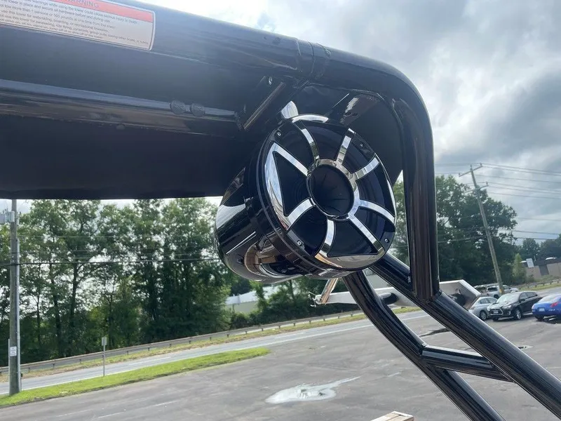 Slide: The Image of 2024 Moomba Tykon boat speaker on a sleek black frame, outdoors. - 32