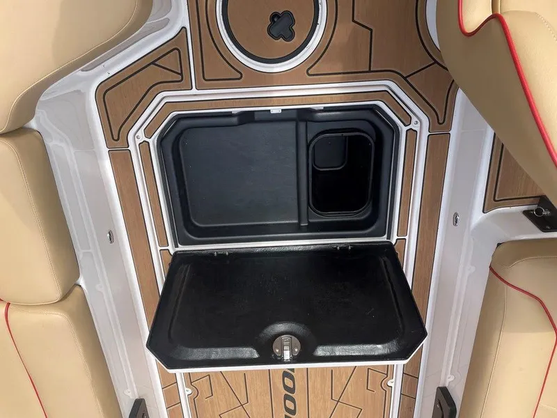 Slide: The Image of 2024 Moomba Tykon boat interior with open storage compartment and stylish seating. - 37