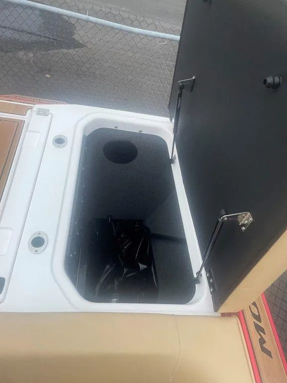 Slide: The Image of 2024 Moomba Tykon boat storage compartment with open lid. - 42