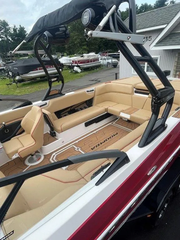 Slide: The Image of 2024 Moomba Tykon boat with tan interior and sleek design. - 7